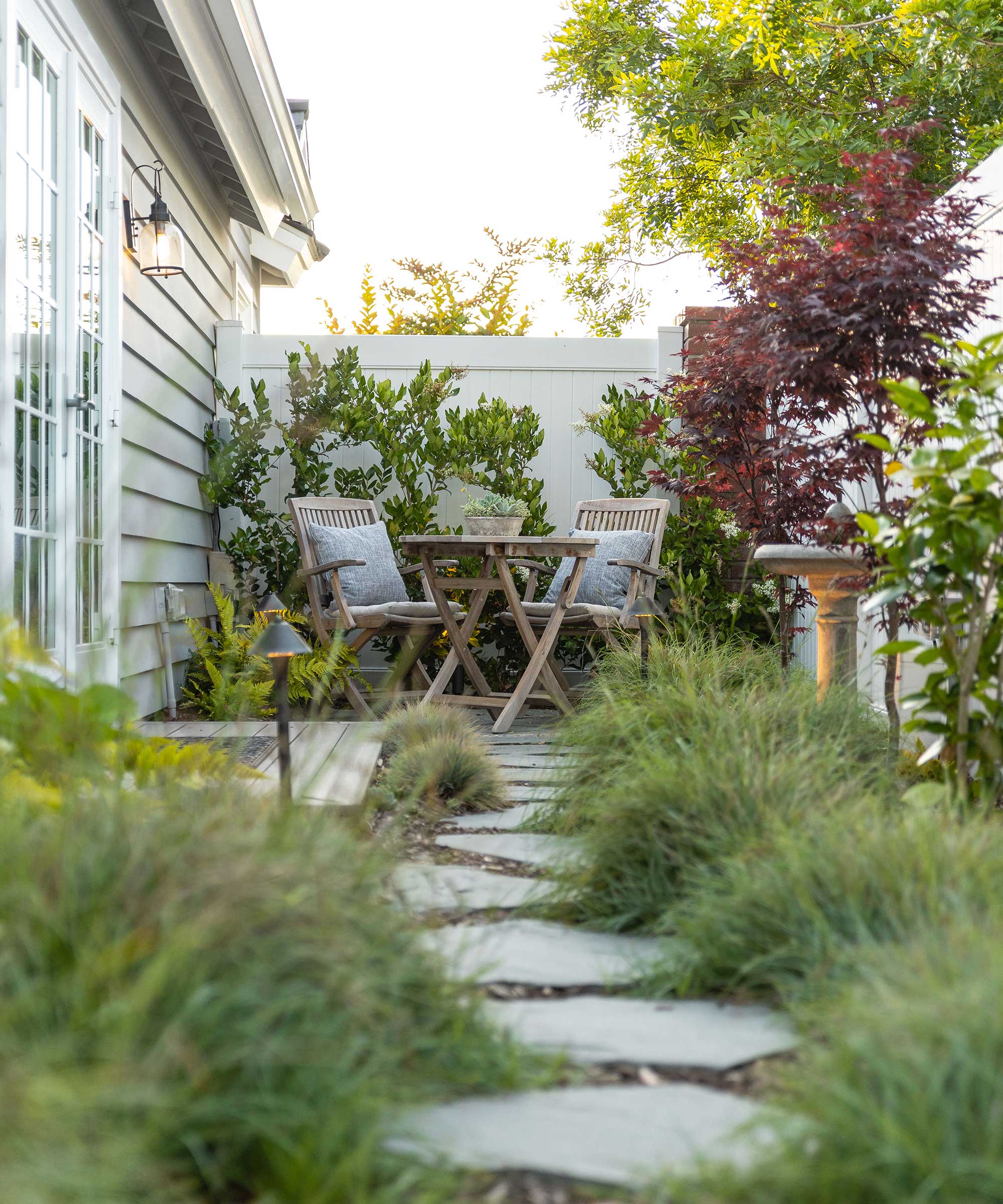 side yard with stepping stone path and seating